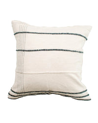 White pillow with black stripes on a white background