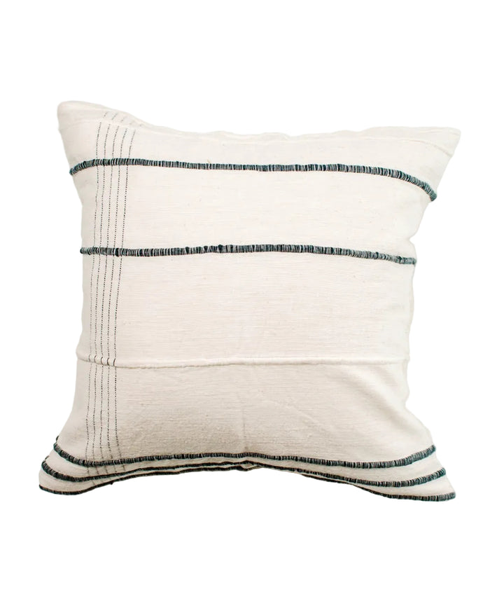 White pillow with black stripes on a white background