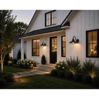 Elegant house exterior with well-maintained garden and lighting fixtures.