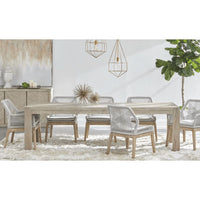 Adler Natural Gray Extension Dining Table with textured acacia wood and six woven chairs.