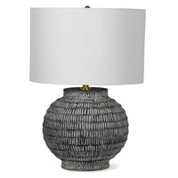 Large Adobe ceramic table lamp with hand-scribed chisel marks, a natural color palette, and a white linen shade.