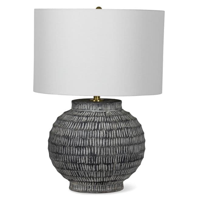 Large Adobe ceramic table lamp with hand-scribed chisel marks, a natural color palette, and a white linen shade.