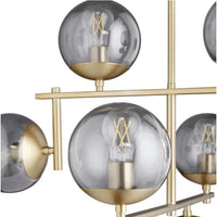 Aiden Aged Brass Globe Chandelier with eight spherical glass lights and gilded linear frames.