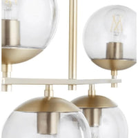 Aiden Aged Brass Globe Chandelier with eight clear spherical glass lights and gilded linear frames.