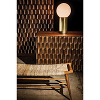 Alameda Carved Dark Walnut Sideboard with hand-carved details, dark finish, and a brass lamp.