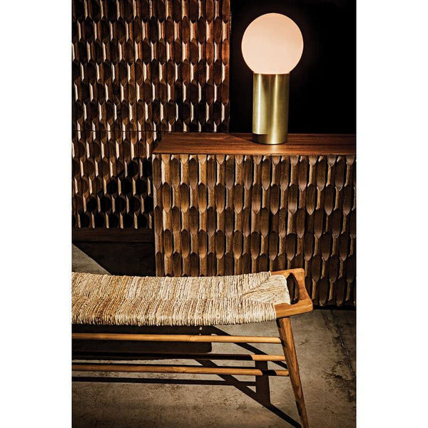 Alameda Carved Dark Walnut Sideboard with hand-carved details, dark finish, and a brass lamp.