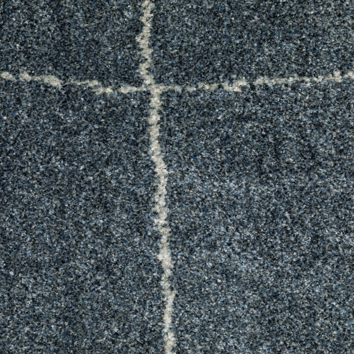 Alton Blue & Beige Casual Rug, close-up of dense, power-loomed polyester yarn with a white grid pattern.