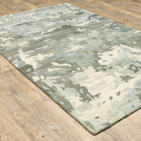 Handmade Anastasia Grey & Charcoal contemporary wool rug with modernized traditional patterns on a wood floor.