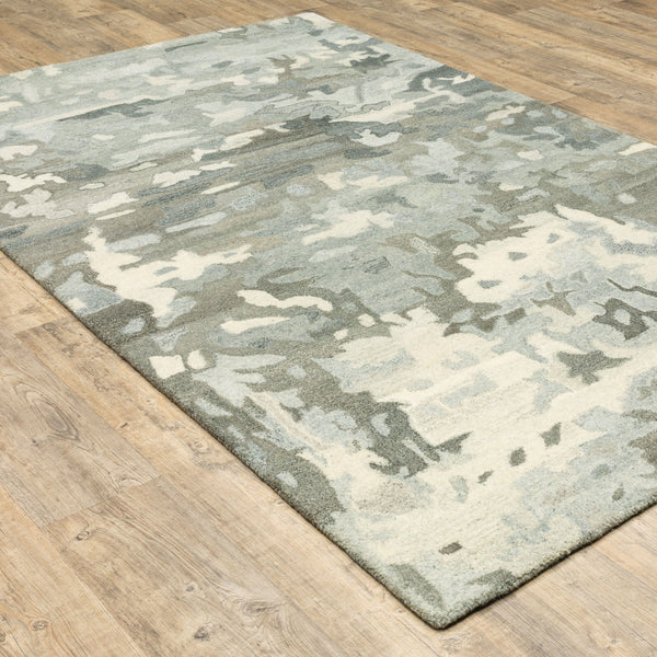 Handmade Anastasia Grey & Charcoal contemporary wool rug with modernized traditional patterns on a wood floor.