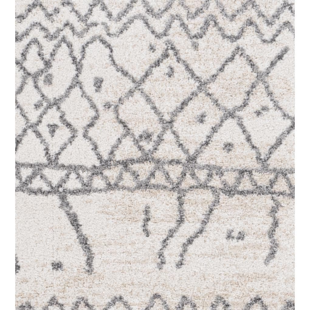 Andorra Charcoal & Beige Rug with globally inspired geometric patterns on a soft polypropylene pile.