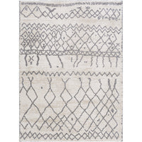 Andorra charcoal & beige polypropylene rug with global geometric patterns on a light background.