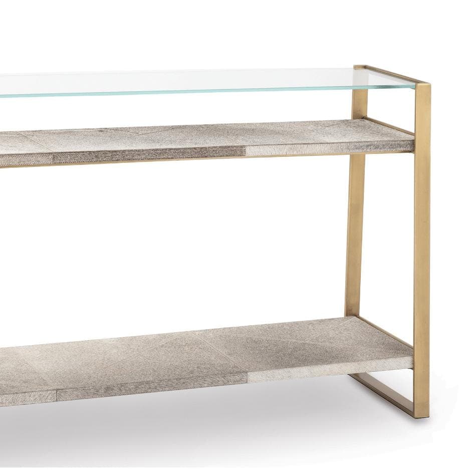 Andres large brass console table with a glass top and two hair on hide shelves.