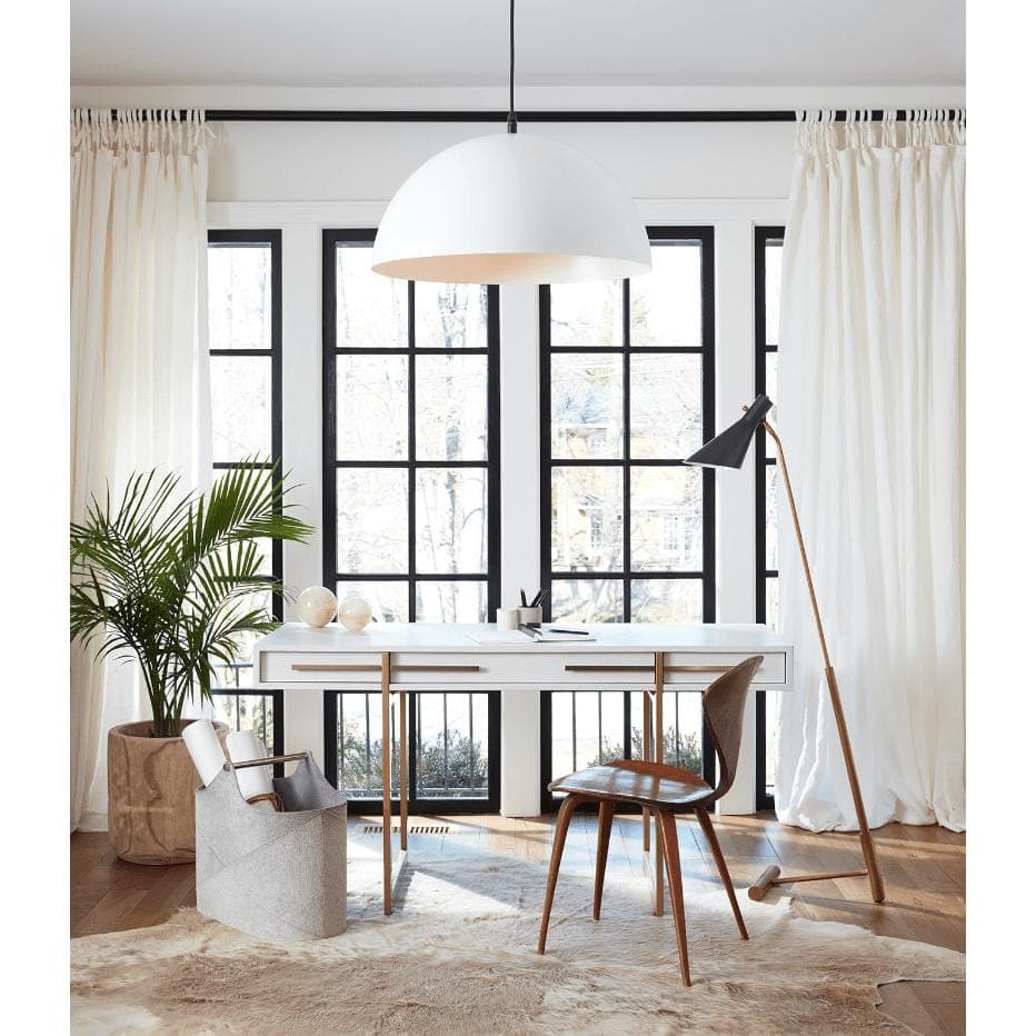 Andres Grey Hair on Hide Basket, a tall, rectangular grey basket with a tactile texture, sits on a light hide rug.