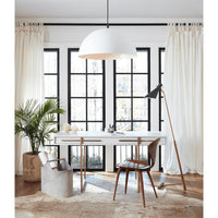 Andres Grey Hair on Hide Basket, a tall, rectangular grey basket with a tactile texture, sits on a light hide rug.
