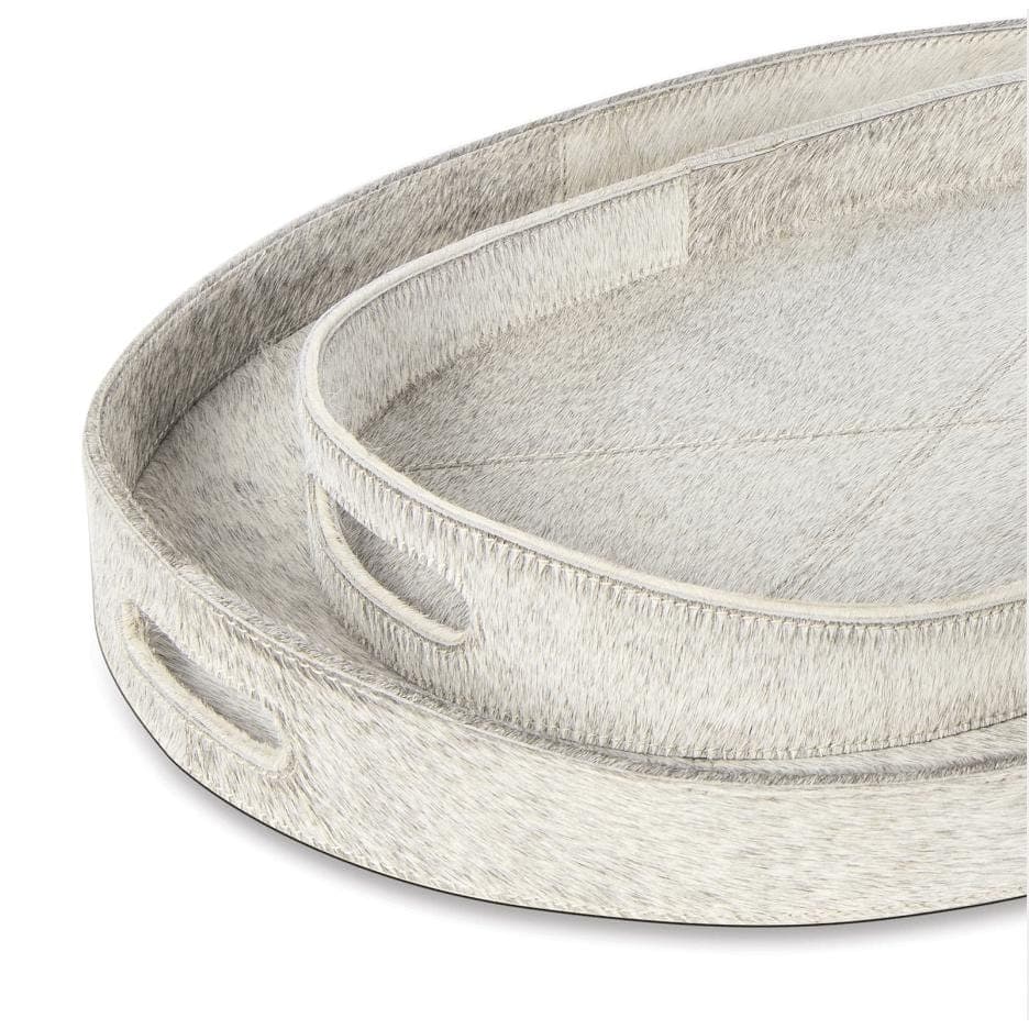 Two oval Andres grey hair on hide trays, one nested inside the other, with cutout handles.
