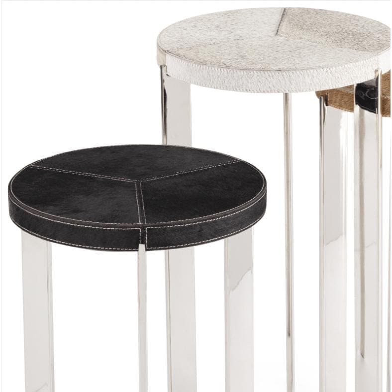 Andres Hair on Hide Trio Table Set with black and natural hide tops, white stitching, and silver metal frames.