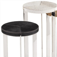 Andres Hair on Hide Trio Table Set with black and natural hide tops, white stitching, and silver metal frames.