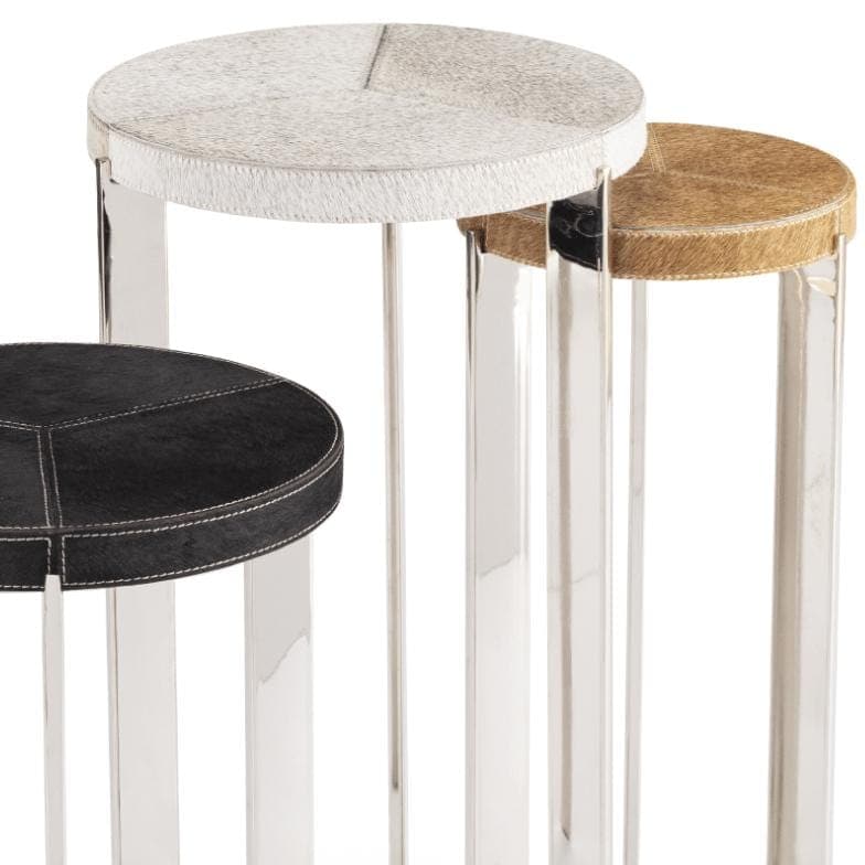 Andres Hair on Hide Trio Table Set: three round tables with natural hair on hide tops in white, brown, and black, on sleek metal frames.