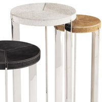 Andres Hair on Hide Trio Table Set: three round tables with natural hair on hide tops in white, brown, and black, on sleek metal frames.