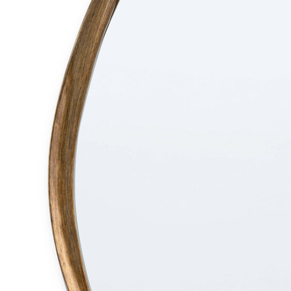 Close-up of Arbre Antique Gold Leaf Mirror's twisted, artisan frame with organic lines.