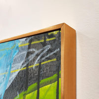 Abstract giclee canvas painting with blue, green, and gray brushstrokes in a gold floating frame.