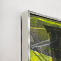 Abstract giclee canvas painting by Wendy Kleine with vibrant green and black brushstrokes in a silver frame.