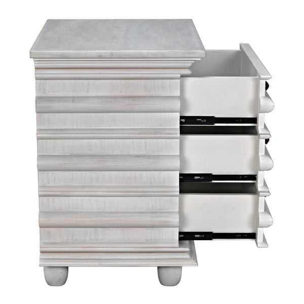Ascona Side Table in white wash mahogany with fluted design, brass pulls, and three open drawers.