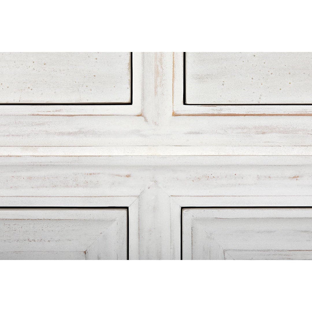 Close-up of Ascona Side Table, white wash mahogany with distressed finish and panel details.