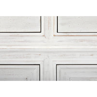 Close-up of Ascona Side Table, white wash mahogany with distressed finish and panel details.