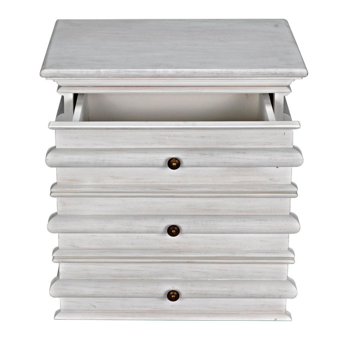 Ascona Side Table in white wash mahogany with three drawers, brass pulls, and an open top drawer.
