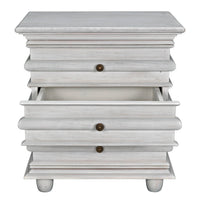 Ascona Side Table in white wash mahogany with brass pulls and three drawers, one partially open.