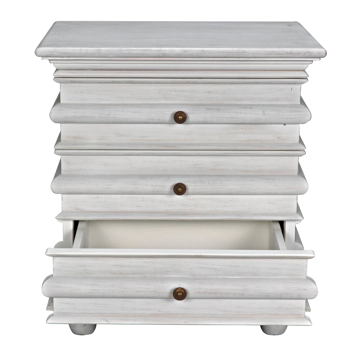 Ascona mahogany side table in white wash with three drawers and brass pulls, bottom drawer open.