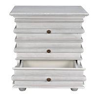 Ascona mahogany side table in white wash with three drawers and brass pulls, bottom drawer open.