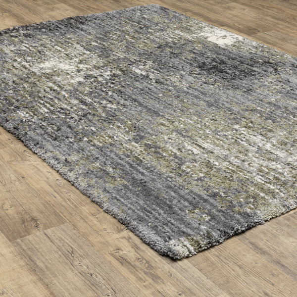 Aspen Grey, Charcoal & Ivory Contemporary Rug with abstract design on a wooden floor.