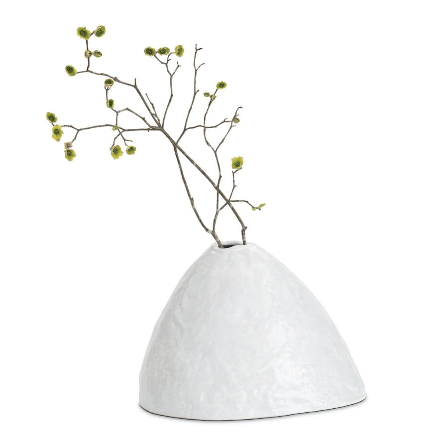 White, hand-molded Atlas ceramic vase with a glossy finish and organic design, holding a branch.