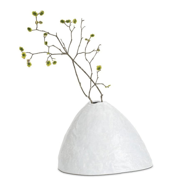 White, hand-molded Atlas ceramic vase with a glossy finish and organic design, holding a branch.