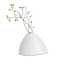 White, glossy Atlas ceramic vase with an organic, hand-molded design, holding a branch with green buds.