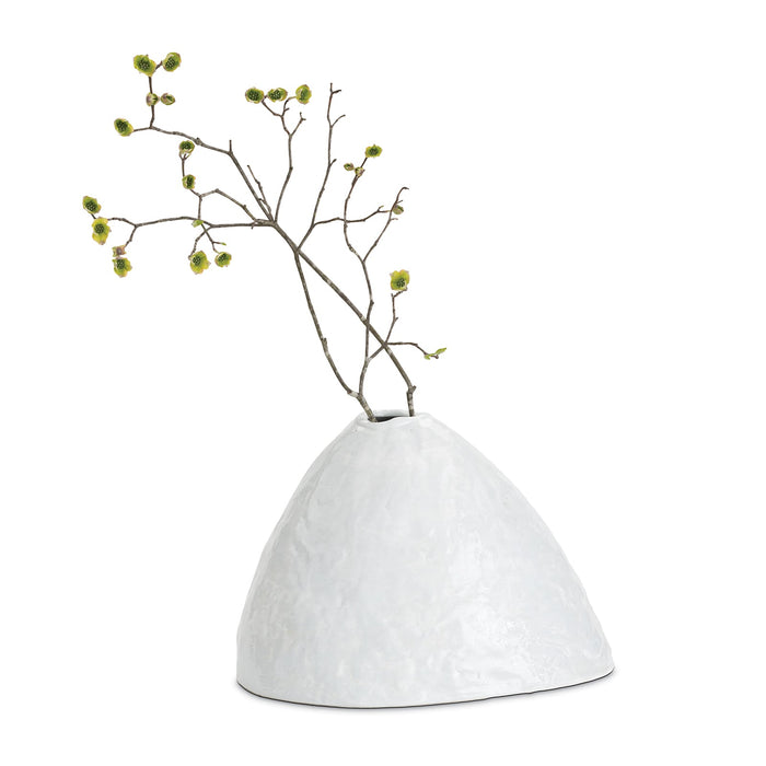 White, glossy Atlas ceramic vase with an organic, hand-molded design, holding a branch with green buds.