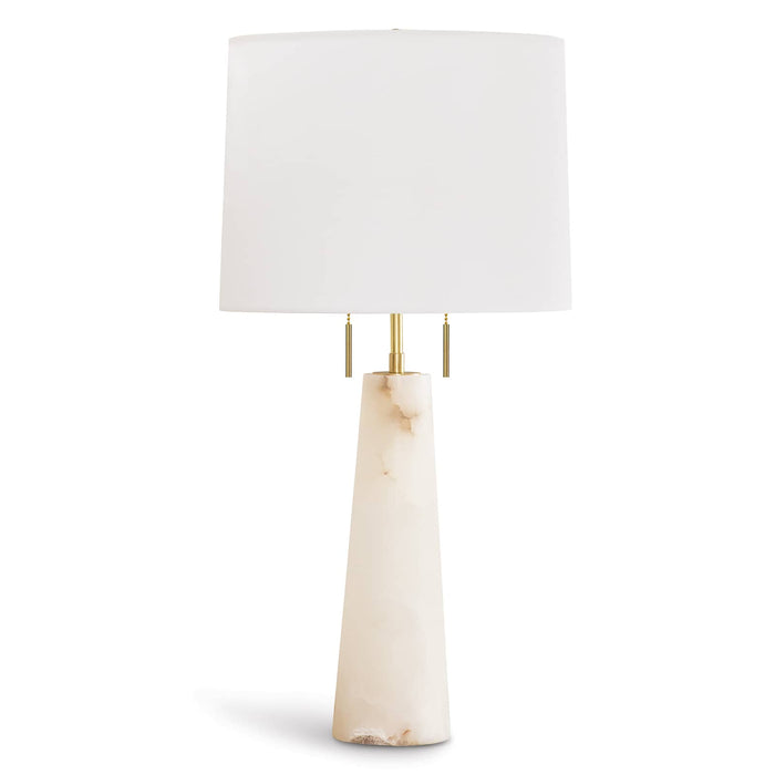 Austen Alabaster Table Lamp with a conical alabaster base, natural brass finish, and a white linen shade.