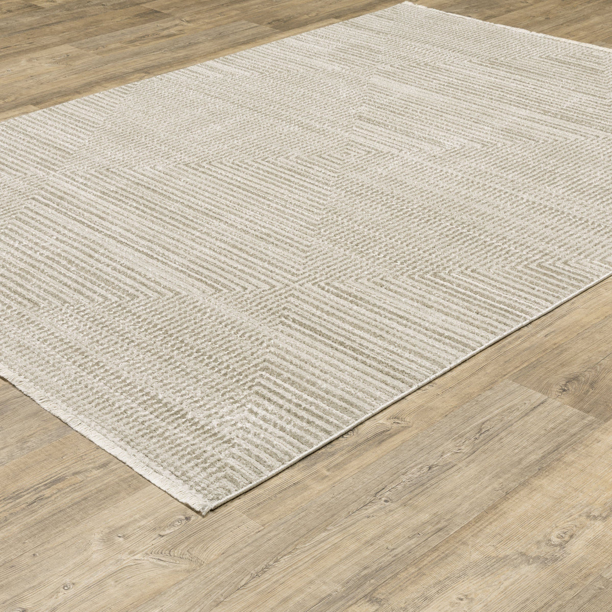 Bauer Beige & Ivory Casual Rug, 100% recycled PET yarn, with a subtle geometric pattern on wood floor.