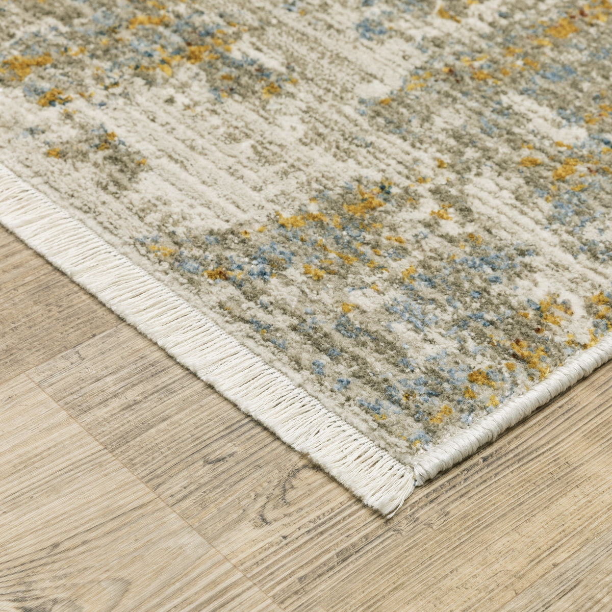 Bauer beige multi-colored contemporary rug with abstract blue and gold accents, made from recycled PET yarn.