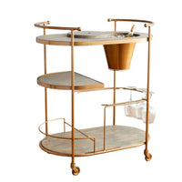 Antique Brass bar cart with three oval wood shelves, ice bucket, and wine glass holders.