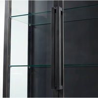 Black iron curio cabinet with glass shelves and a long, dark handle.