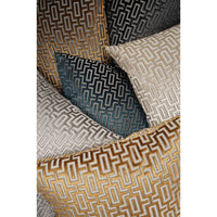 A stack of Bergman decorative throw pillows in various colors: gold, teal, black, gray, and beige, all featuring a geometric maze pattern.