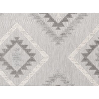 Big Sur Gray Cream indoor/outdoor rug with geometric diamond and triangle pattern.