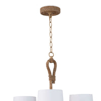 Bimini large chandelier with natural woven seagrass, looped detailing, and white linen shades.