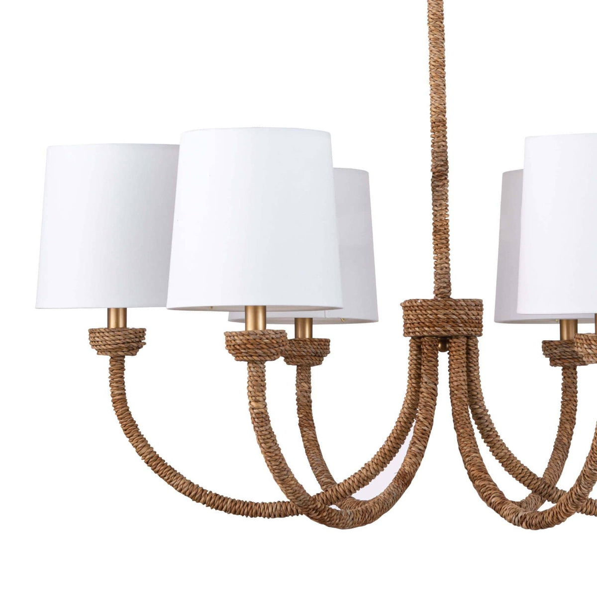 Bimini Small Chandelier with natural woven seagrass arms, polished brass accents, and six white linen shades.
