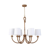 Small Bimini Chandelier with natural woven seagrass, looped detailing, and six crisp white linen shades.