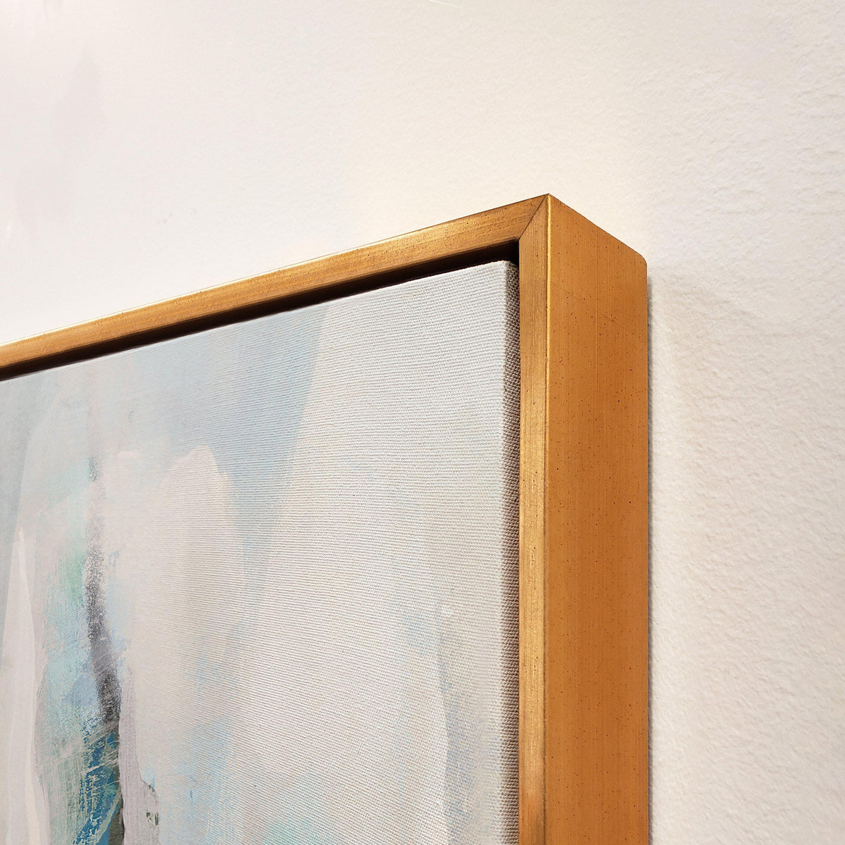 Abstract giclee canvas painting with blue and white strokes, framed in a gold gallery-wrapped style.