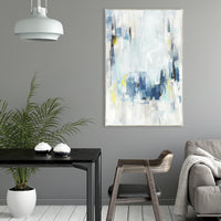 Abstract giclee canvas painting with blue, white, and yellow strokes in a modern interior.